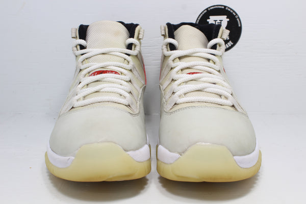 Air jordan shops 11 cream and red